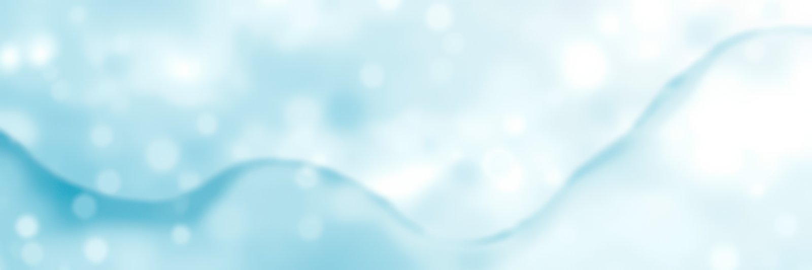 Soft blue waves create a serene atmosphere with gentle ripples and bokeh effects during daytime in a peaceful setting